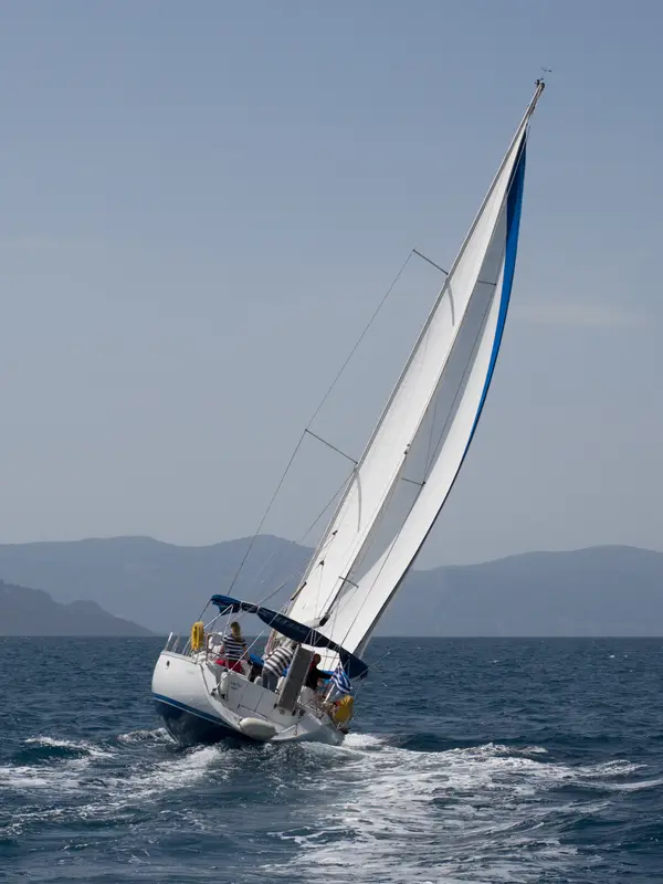 A sailing yacht heeling upwind