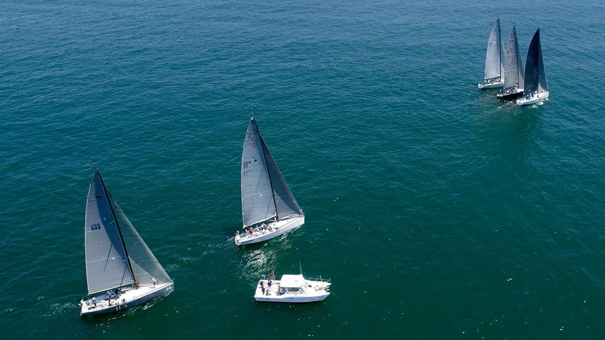 A sailing yacht heeling upwind in a regatta
